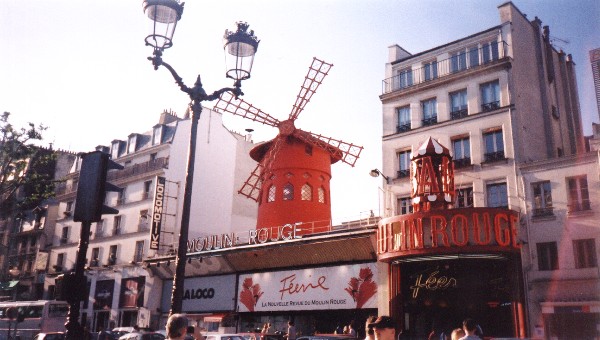 Outside the Moulin Rouge, with its landmark red windmill on the roof